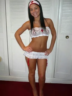 brunette beauty in sexy nurse lingerie