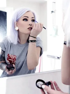 hot! lavender haired glam-punk putting on her makeup