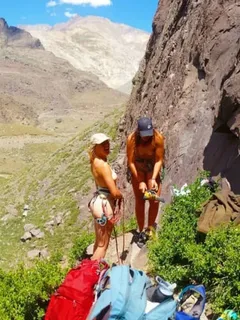 catching two nude women about to climb.