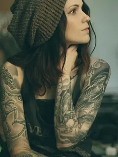 sad emo babe tattoo in beautiful picture with alot of tattoos on the body