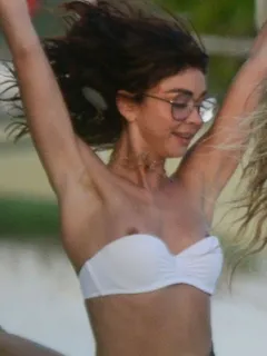 sarah hyland nip slip wardrobe malfunction accidentally flashing her nipples in a bikini at the beach in mexico for new years eve seen by pa