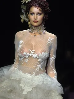 french actress and model laetitia casta nude boobs under see through dress runway photo